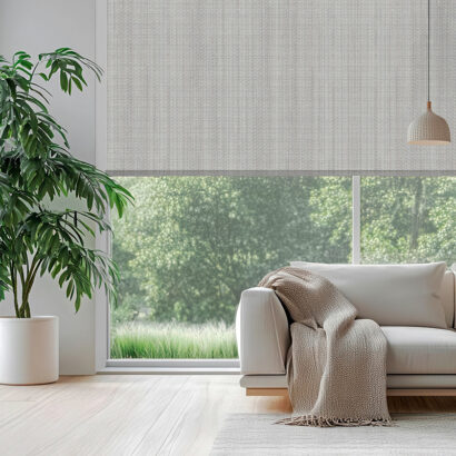 living room setting with stylish white roller blinds filtering s