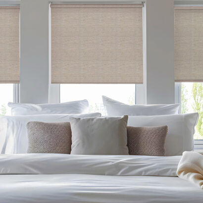 Modern bedroom with beige blackout roller blind and plastic wind